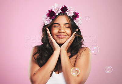 Buy stock photo Beauty, relax and bubbles with woman and flower crown in studio for cosmetics, skincare and wellness. Hair care, spa treatment and face with person on pink background for spring, glow and makeup 