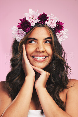 Buy stock photo Woman, flowers and crown for thinking of beauty in studio with natural skincare, spring plants and pink background. Face, model and floral wreath for sustainable cosmetics, dermatology and hair care