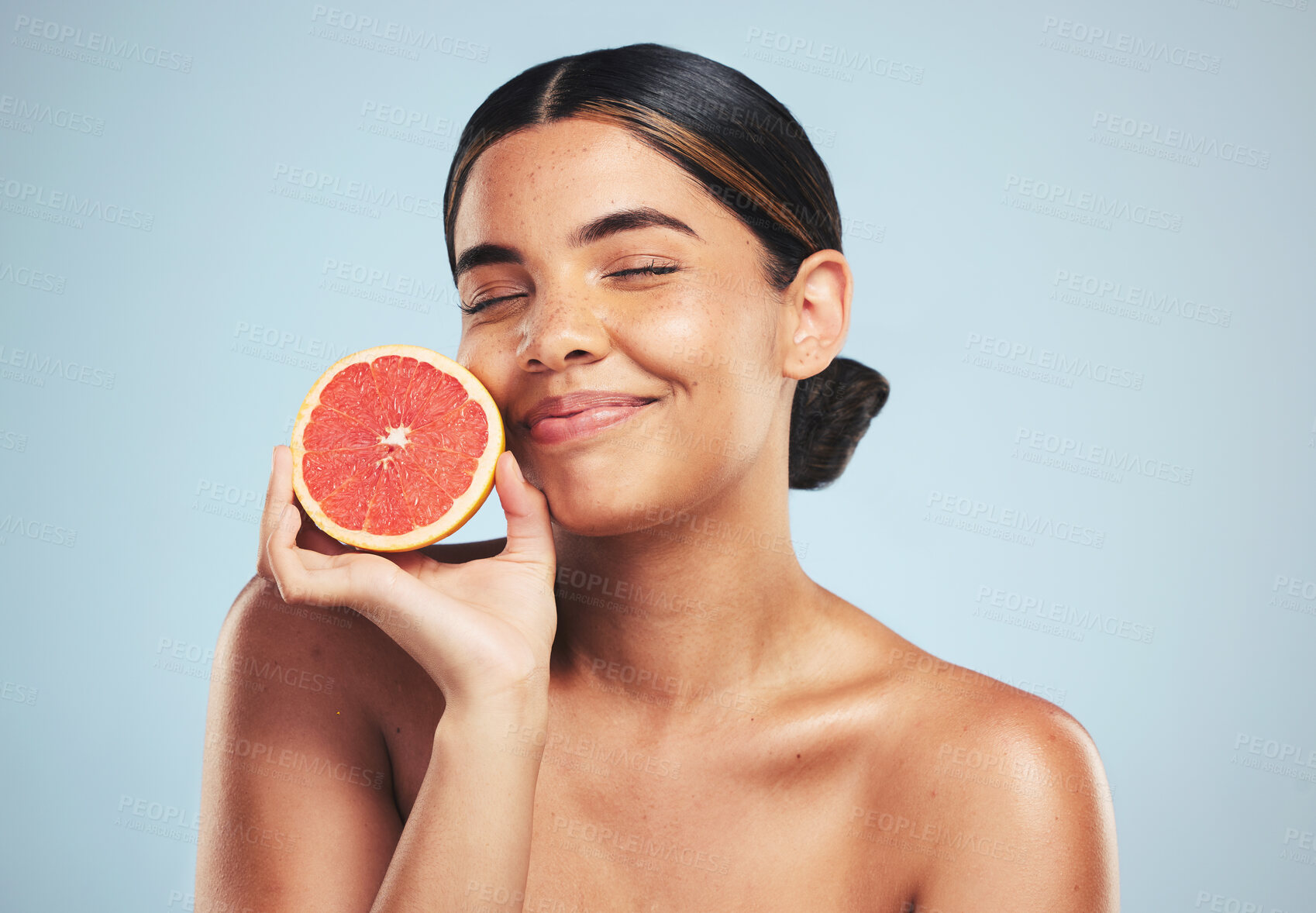 Buy stock photo Skincare, smile and woman in studio with grapefruit for natural skin beauty or wellness on grey background. Happy, fruit and female model with citrus cosmetics for vitamin c, collagen and anti aging 