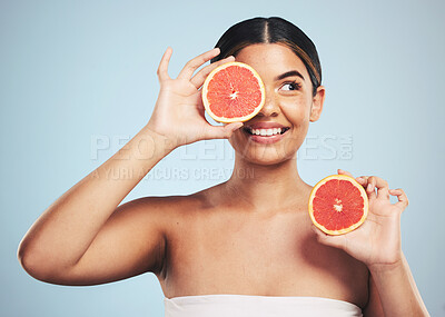 Buy stock photo Smile, skincare and woman in studio with grapefruit for natural skin beauty or wellness on grey background. Happy, fruit and female model with citrus cosmetics for vitamin c, collagen and exfoliate 