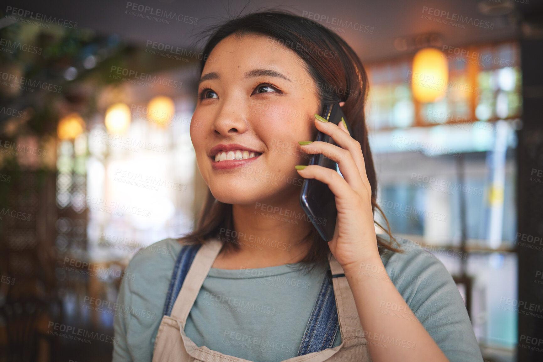 Buy stock photo Restaurant, phone call and Asian woman for order, delivery and online food service in cafeteria. Coffee shop, small business and happy waitress, cafe barista or manager on smartphone in discussion