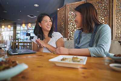 Buy stock photo Girl friends, sushi restaurant and eating with smile, comic chat or joke at meeting, laptop and table. Japanese students, happy and together for fish, seafood or diner with plate, talking or memory