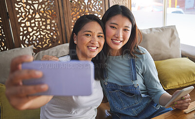 Buy stock photo Selfie, love and a lesbian couple in a restaurant for a romantic date together on their anniversary. LGBT, smile and happy asian woman with her partner in a cafe for celebration of a milestone event