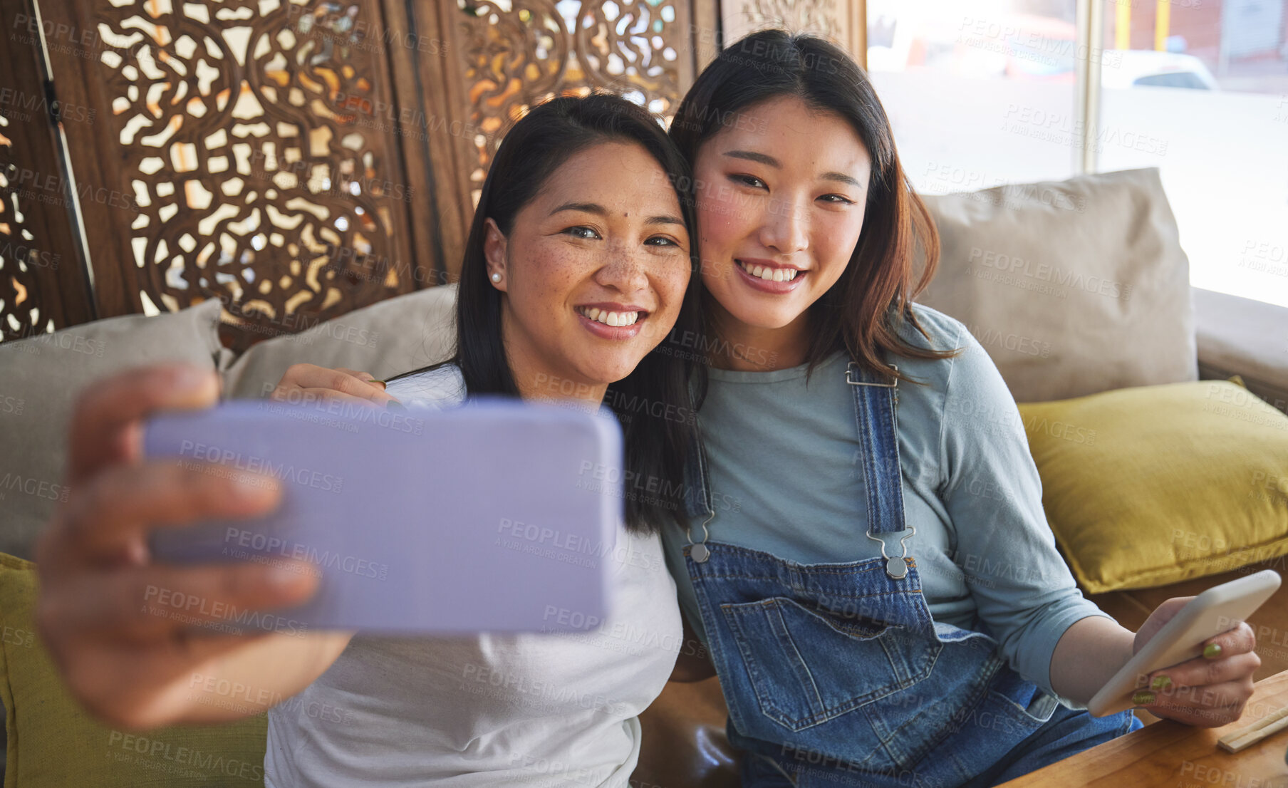 Buy stock photo Selfie, love and a lesbian couple in a restaurant for a romantic date together on their anniversary. LGBT, smile and happy asian woman with her partner in a cafe for celebration of a milestone event