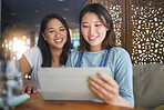 Restaurant, tablet and Asian women for menu, food options and online order for lunch, meal or dinner. Coffee shop, cafe and happy friends on digital tech for social media review, website and app