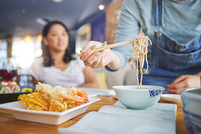 Buy stock photo Hand, ramen and chopsticks for Chinese food with a woman closeup in a restaurant to eat a meal. Soup, noodles and cuisine with a customer in an eatery for nutrition or traditional Japanese dinner