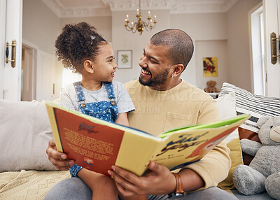 Buy stock photo Man, child and book on sofa with smile, bonding and love in storytelling in living room together. Happiness, father and daughter reading story on couch for fantasy, learning and education in home fun