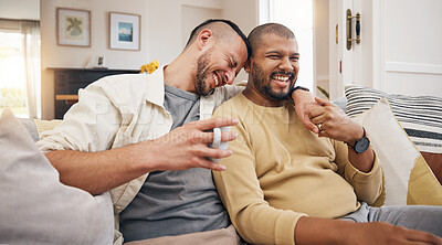 Buy stock photo Laughing, relax and a gay couple on the sofa with coffee, conversation or love in a house. Happy, together and lgbt men on the living room couch for a funny story, communication or speaking with tea