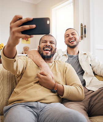 Buy stock photo Men, lgbtq couple laughing and selfie in home living room, bonding and funny together. People, gay and profile picture, happy memory or smile on social media in love, care and interracial hug on sofa