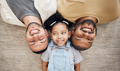 Buy stock photo Gay dad, blended family and adoption with a girl lying together on the floor of the home for love from above. LGBT smile, children or kids and a daughter bonding with her happy parents in the house