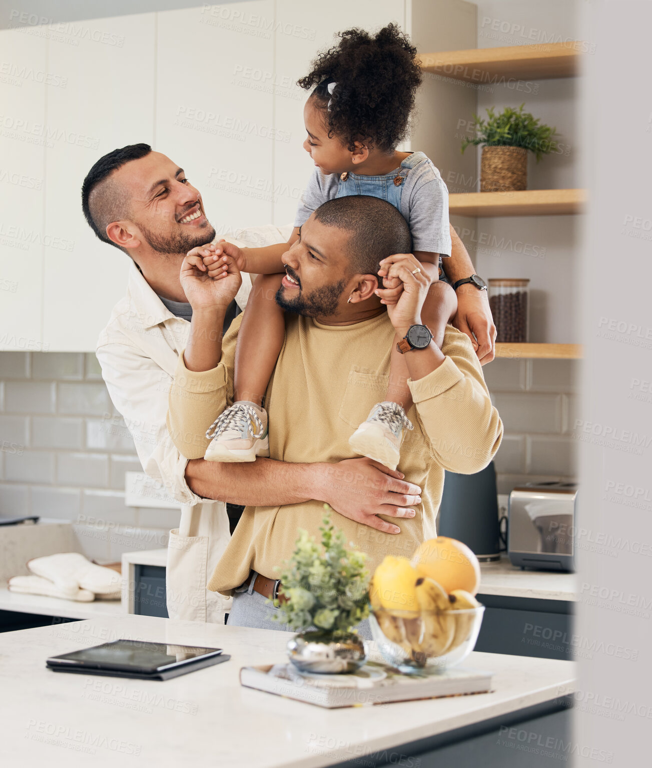 Buy stock photo Happy family, child and gay parents in home together with love, support and bonding with girl on shoulders of dad in hug. LGBT, fathers and men with happiness or smile in kitchen and playing with kid