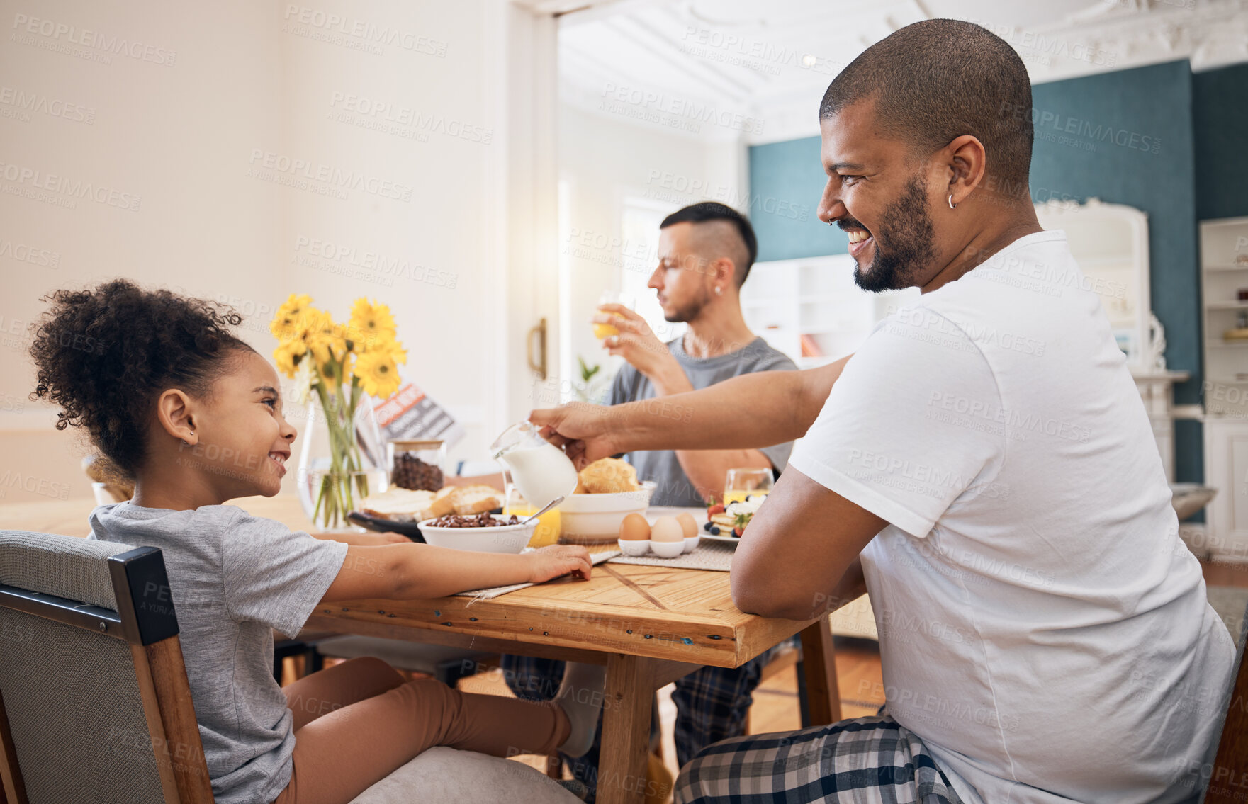 Buy stock photo Gay couple, home breakfast and family child smile for morning food, wellness and parents pour milk. LGBTQ, adoption and homosexual dad happy for hungry kid, youth girl or daughter eating cereal