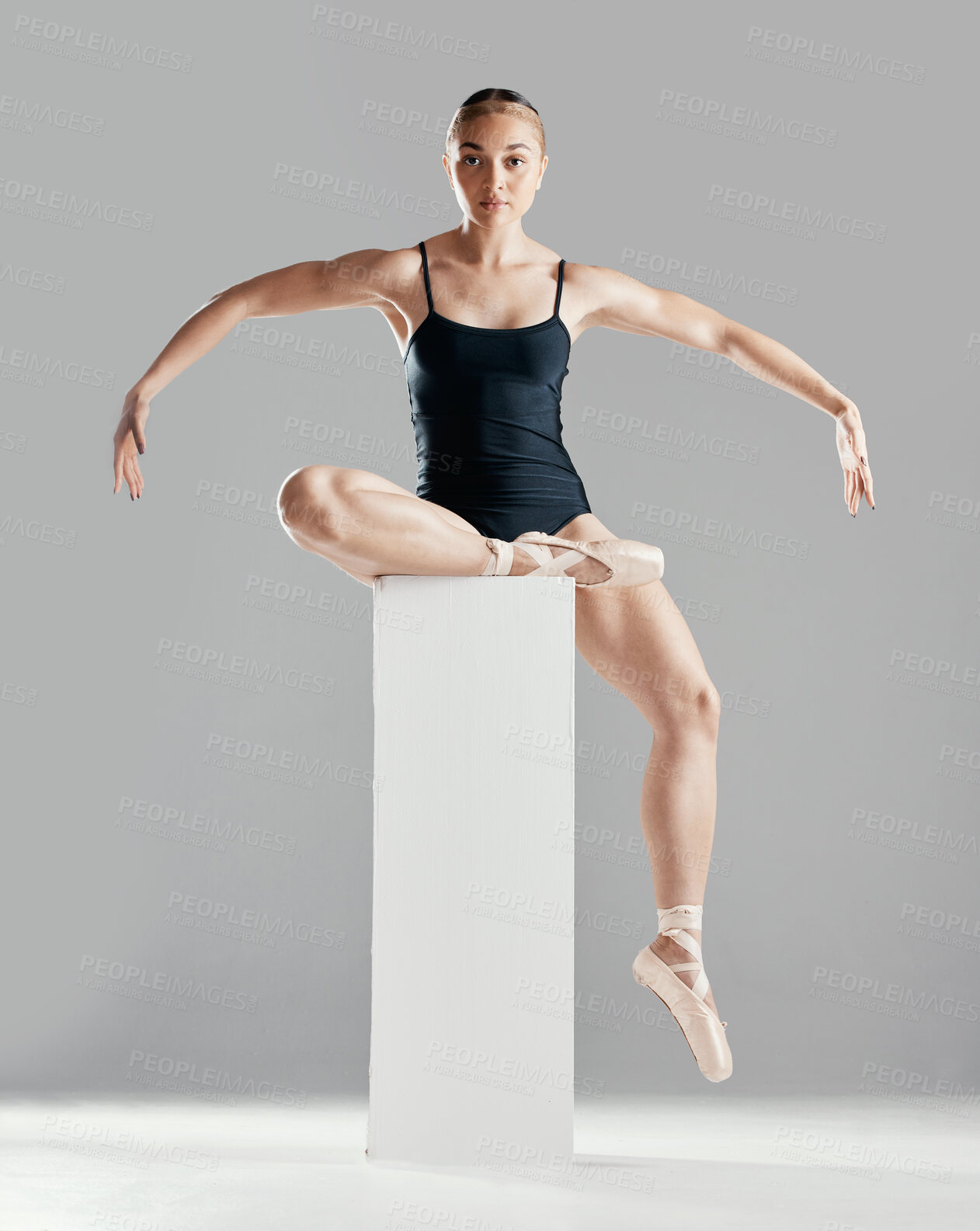 Buy stock photo Balance, ballerina or woman on block in studio in creative portrait or elegant performance for art or freedom. Girl, dancer or ballet dancing or training to exercise on platform or white background