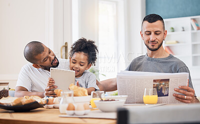 Buy stock photo Gay parents, morning and breakfast with child in a home with reading and tablet with dad. Food, house and family with bonding, care and love together at dining table with paper and tech with kid