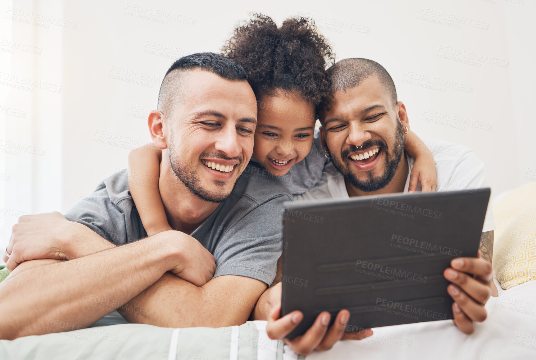 Buy stock photo Tablet, gay family and child on a bed at home for e learning, watch video and education on internet. Adoption, lgbt men or parents with a happy kid and technology for streaming movies, games or app