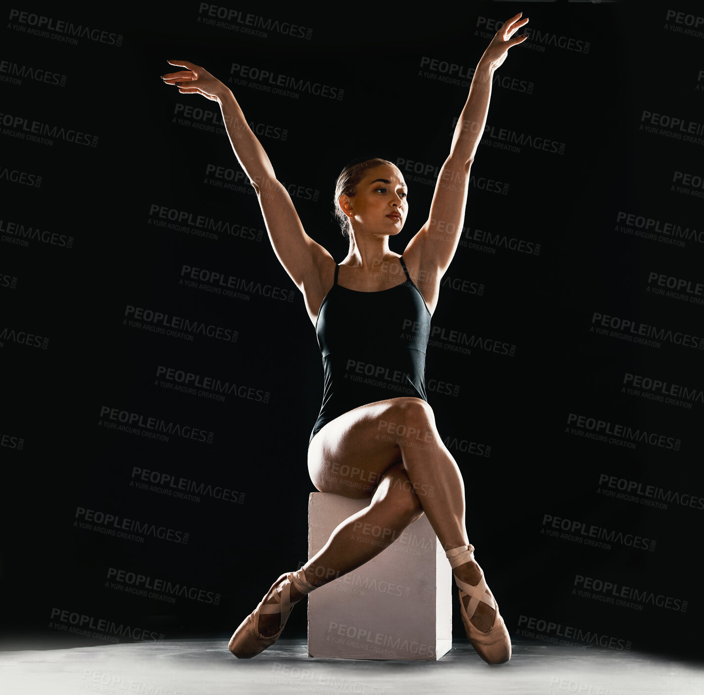 Buy stock photo Creative, ballet and art with woman in studio for dance, performance and theater. Health, energy and beauty with ballerina and balance on pedestal on black background for stage, grace and elegance