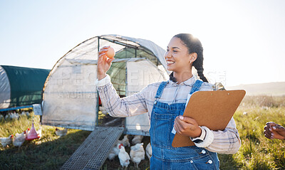 Buy stock photo Agriculture, farm and a woman with an egg for inspection and a clipboard for quality control. Farming, sustainability and a poultry farmer person with organic produce outdoor for growth or production