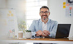 Portrait of businessman at office desk with smile, laptop and tablet on business website, online report or social media. Internet, digital app and confident, mature man with workshop and web schedule