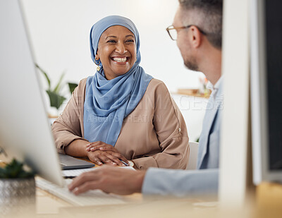 Buy stock photo Smile, teamwork and business people in office for training, advice or collaboration while working on computer. Smile, help and Muslim senior woman mentor laugh with colleague while brainstorming idea