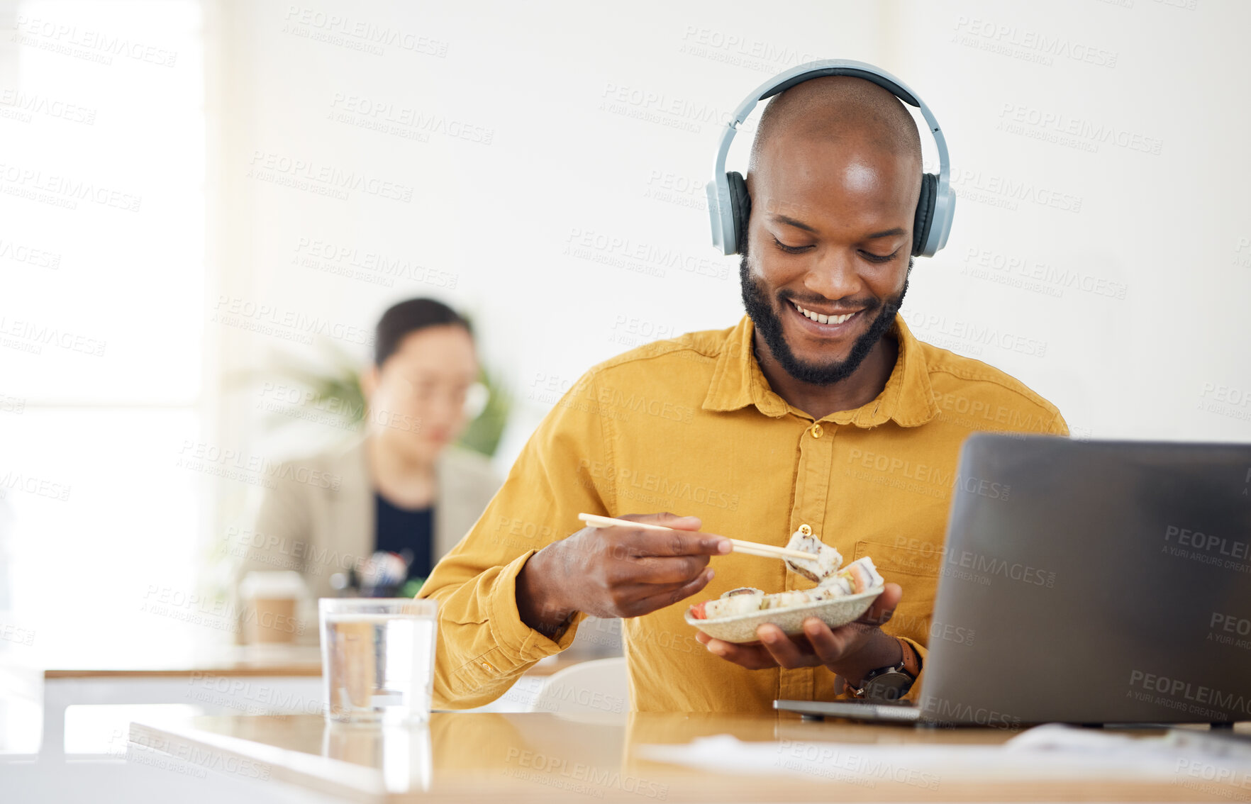 Buy stock photo Food, delivery and happy black man with laptop in office for lunch break, eating and meal. Sushi, brunch and African manager online with positive review, survey or feedback for takeout order service