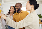 Whiteboard, teamwork and business people planning in office brainstorming for creative project. Collaboration, analysis and young designers reading ideas or information for strategy in the workplace.