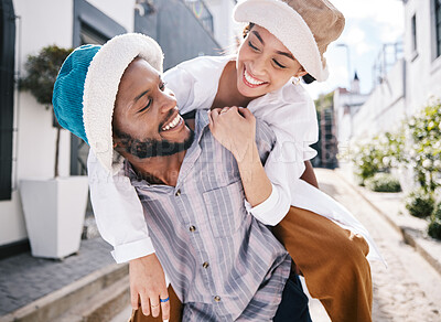 Buy stock photo Happy interracial couple, love or piggyback in city to travel on romantic date to play a fun outdoor game. Smile, eye contact or black man carrying gen z girl in silly, goofy or playful joke together