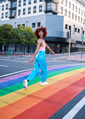 Buy stock photo Happy, walking and a woman on a pride street for a celebration of freedom of love. Smile, city and a girl or person in support of lgbt community on a rainbow road for equality, excited and identity