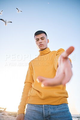 Buy stock photo Man, hand and beach portrait for follow sign, choice and call for vacation, outdoor and adventure in nature. Gen z guy, student and open palm for decision, holiday and recruitment by ocean in summer