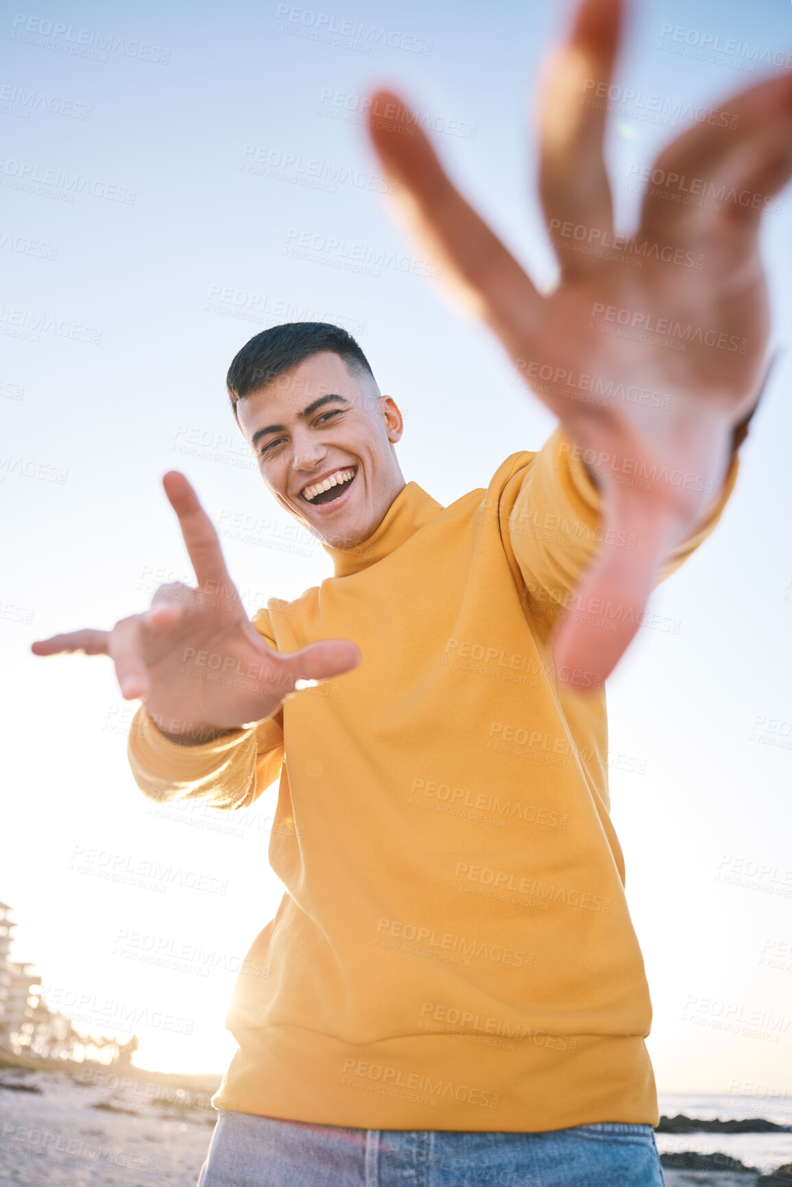 Buy stock photo Frame, summer and a man with hands at the beach with happiness, freedom and creativity. Smile, portrait and a young person at the sea with a gesture for perspective on a vacation at the ocean