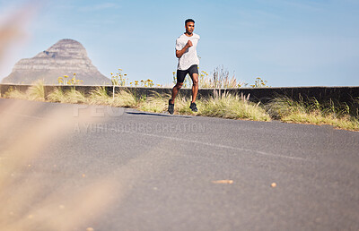 Buy stock photo Man, running and training on road in mountain, nature or outdoor exercise and athlete in healthy workout in Cape Town. Male, runner and morning cardio, sports goals or fitness challenge in summer