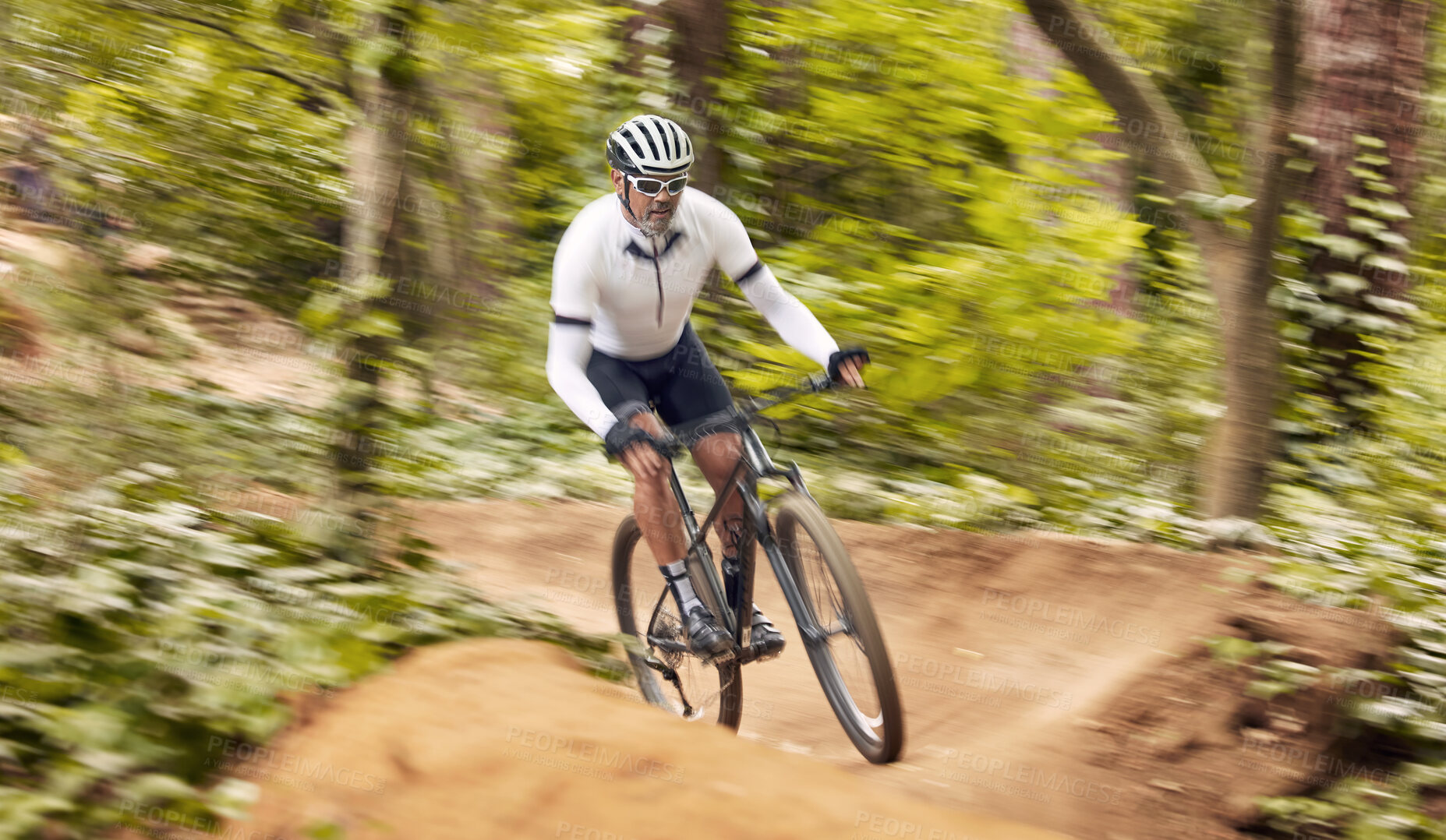 Buy stock photo Nature cycling, bicycle and sports man travel, ride and journey on off road path, outdoor challenge or exercise. Fast mountain bike, speed blur and athlete training, fitness and workout in forest