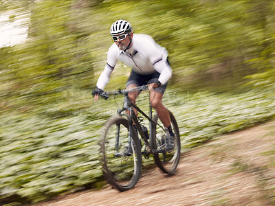 Buy stock photo Fast, cycling and man on a bike in nature for fitness, sports or a competition. Energy, mountains and a male cyclist on a bicycle in the woods with speed for exercise, cardio or training in a forest
