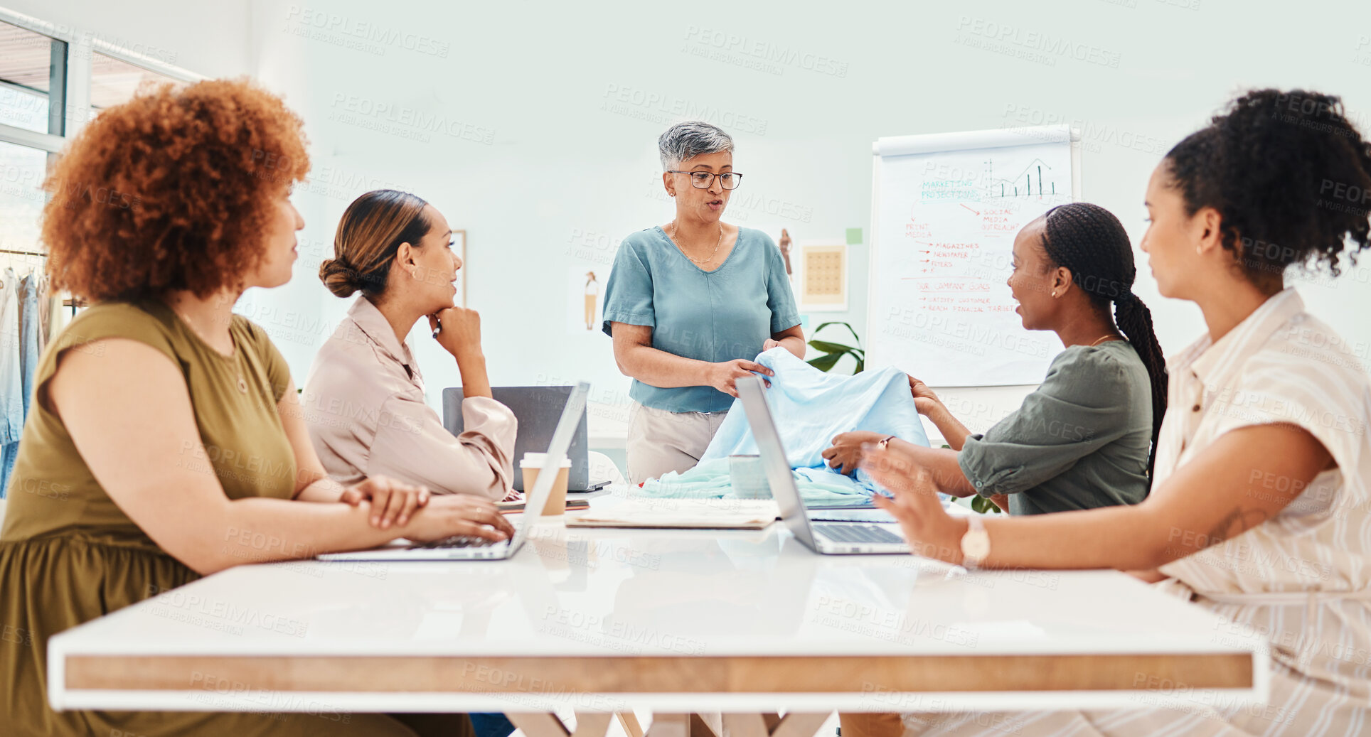 Buy stock photo Creative woman, fashion designer and meeting in clothing discussion, style or ideas at the office. Group of female employees in team planning, design or garment in retail startup at the workplace