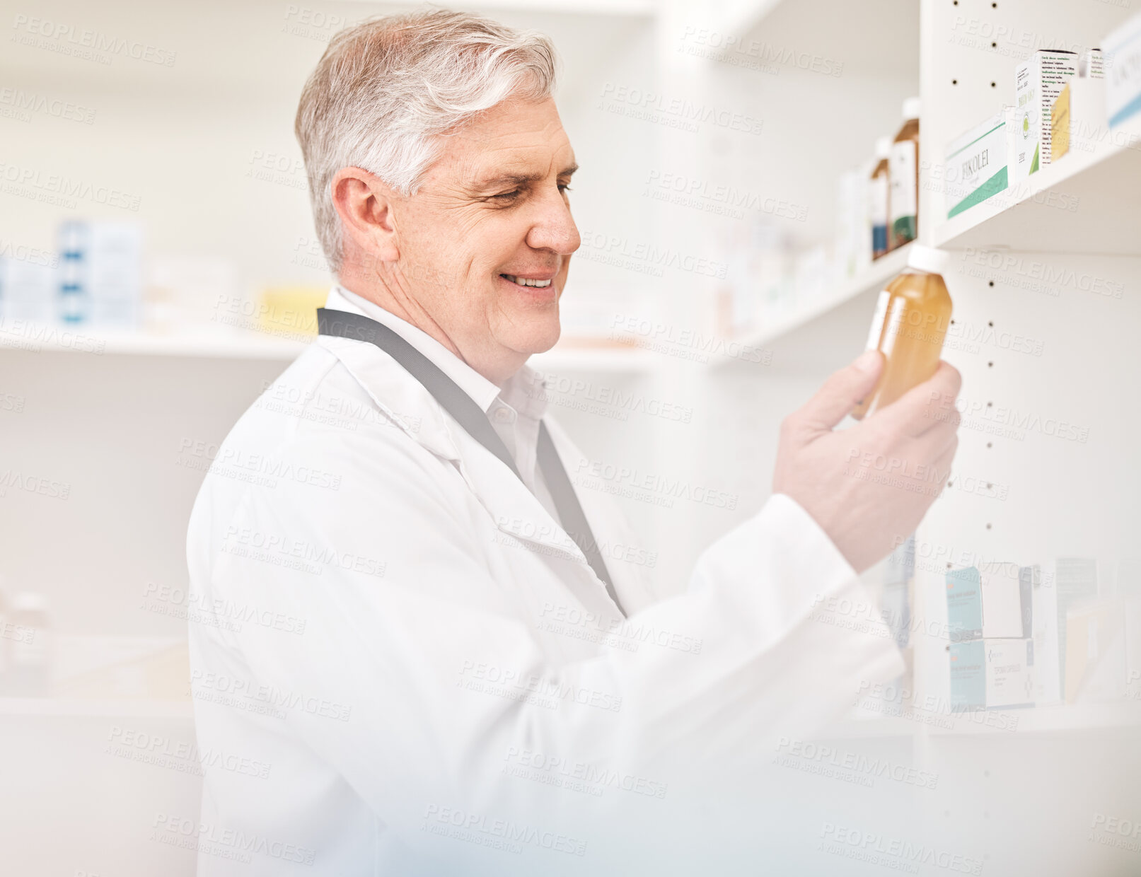 Buy stock photo Medical, product and a senior man in a pharmacy looking for prescription medicine on a shelf. Bottle, healthcare or trust with a happy pharmacist in a drugstore for chronic medication inventory