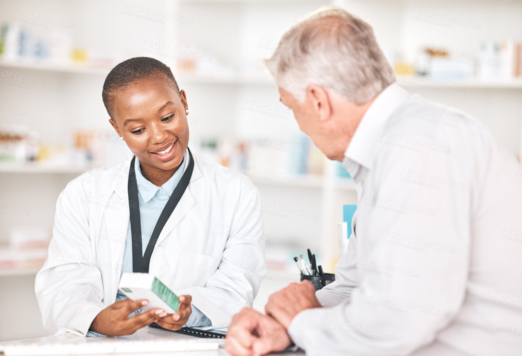 Buy stock photo Explain, medication and pharmacist with patient in pharmacy for medical assistance at dispensary. Discussion, medicine and black woman talking to a senior man at the counter of a pharmaceutical store