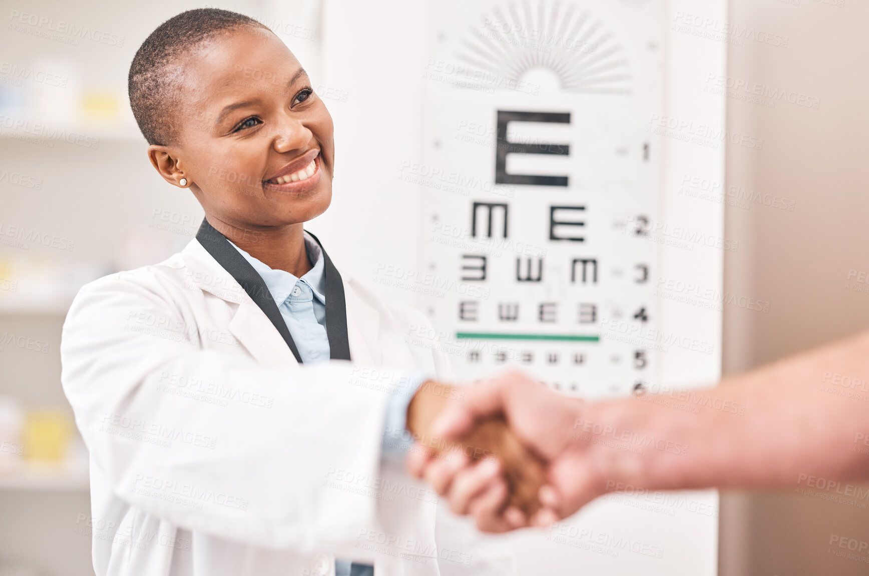 Buy stock photo Optometrist woman, handshake and smile with patient, customer and happy for agreement, deal or sale. African ophthalmology doctor, shaking hands and kindness for healthy eyes, wellness or healthcare