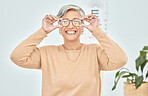 Mature woman, portrait and glasses for vision eye, test and optometry in clinic wellness, choice and prescription frames. Person, smile and Mexican patient in store, shop and eyesight retail decision