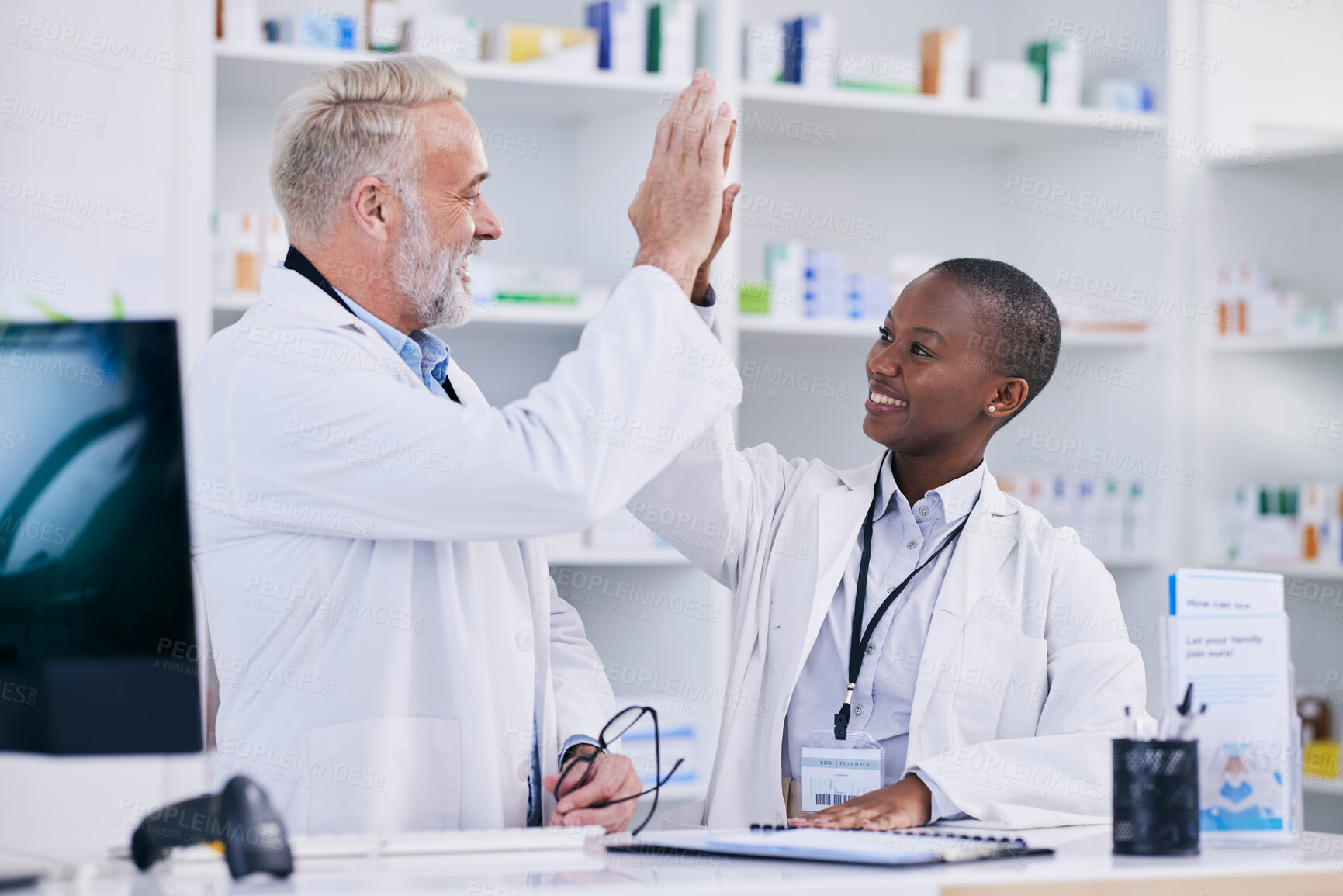 Buy stock photo Pharmacy, high five and teamwork with people in store for medical, success or motivation. Medicine, healthcare and support with man and woman in pills dispensary for community, mentorship or learning