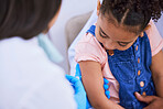 Girl, parent and doctor with syringe for vaccine, flu shot or medicine injection in clinic or hospital. Father, kid and pediatrician in office with needle for vaccination, consultation and child care