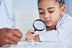 Child, science and girl with a magnifying glass in laboratory learning, research or curious to study chemistry in education. Kid, scientist and check with a magnifier on experiment, test or analysis