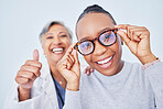 Eye care, glasses and patient with doctor, women at clinic, optometry and frame choice with help and thumbs up. Wellness, health and prescription lens, support from optometrist, trust and eyewear
