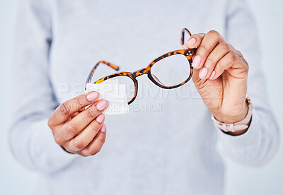 Buy stock photo Hands, cleaning lens and glasses, hygiene and vision with eye care and health, wipe and dust with pattern frame. Optometry, visual and person with eyewear, maintenance and wellness with improvement