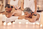 Luxury, massage and hot stones with old couple in spa for vacation, relax and beauty salon. Peace, wellness and holiday with senior woman and man in hotel villa for retirement, treatment or body care