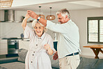 Holding hands, relax or happy old couple dancing for love or fun in marriage at home together. Joy, romantic elderly man or senior woman bonding with smile or care in retirement or house living room