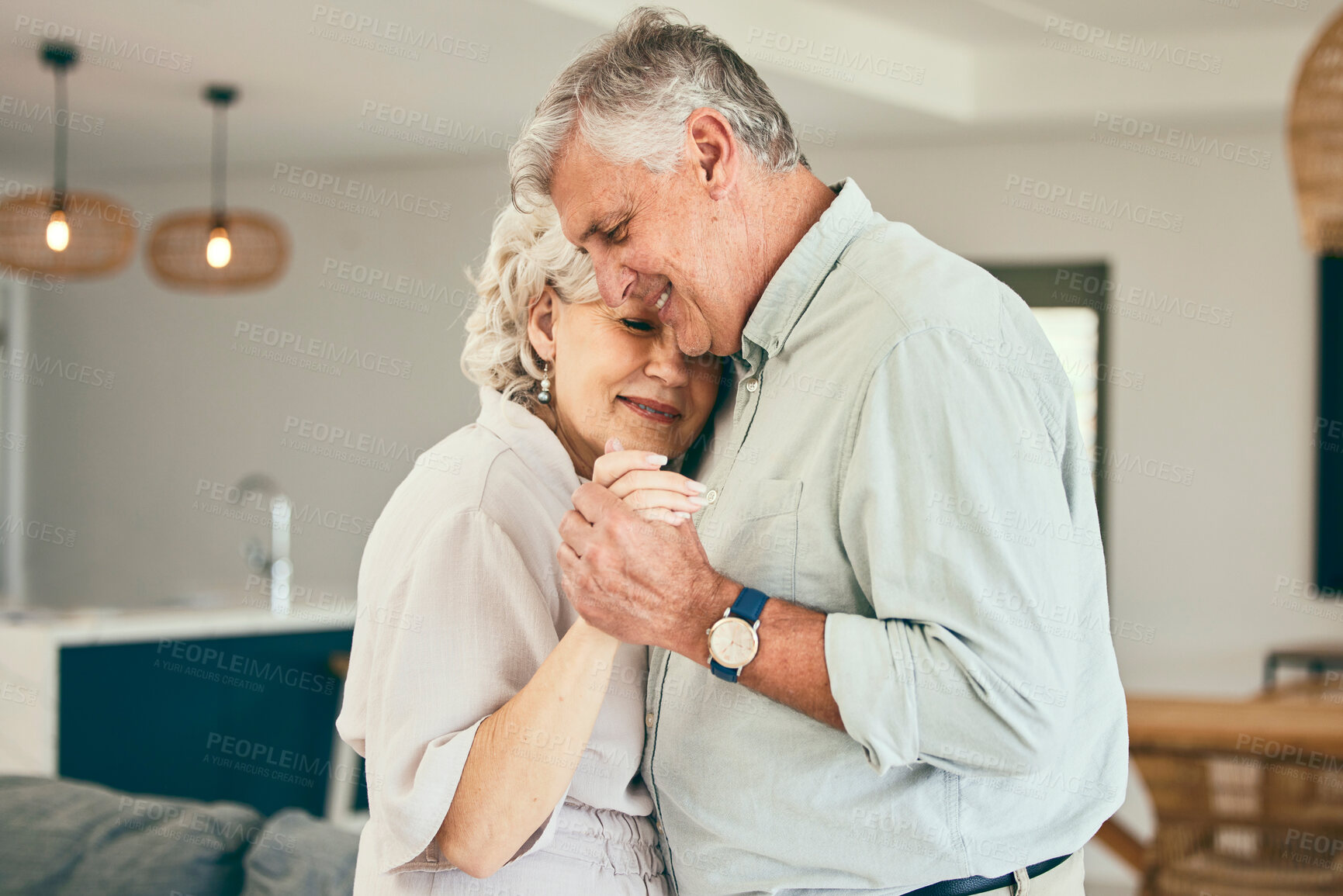 Buy stock photo Holding hands, hug or happy old couple dancing for love, support or trust in marriage at home together. Smile, romantic elderly man or senior woman bonding with care in retirement in the living room