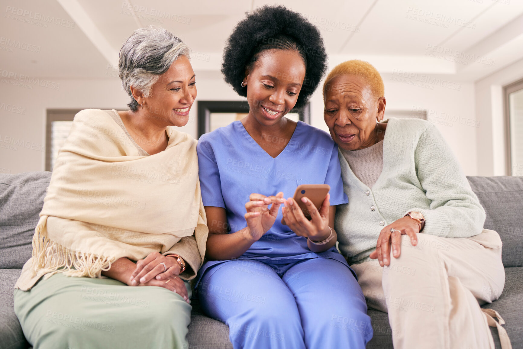 Buy stock photo Phone, caregiver and senior women on sofa to browse internet, telehealth and mobile app together. Retirement, nursing home and nurse with elderly people on smartphone for medical result or report