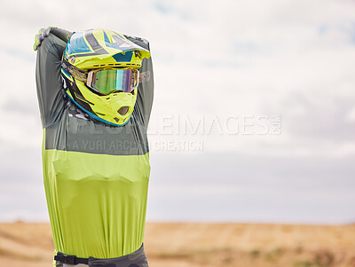 Buy stock photo Sports, stretching and man with helmet in nature for training, workout and performance. Travel, mockup space and person outdoors for motor cycling for adventure, freedom and adrenaline in desert