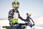 Sports, desert and man with helmet on motorbike for training, workout and challenge on sand. Extreme transport, travel and cyclist with motorcycle for adventure, freedom and adrenaline for action
