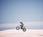 Bike, sky and jump with a man on mockup riding a vehicle in the desert for adventure or adrenaline. Motorcycle, speed and space with an athlete on sand in nature for freedom, power or competition