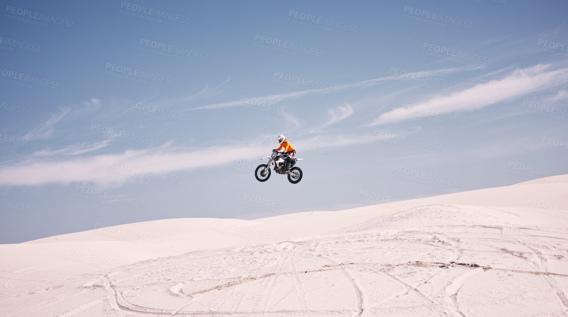 Buy stock photo Bike, mockup and jump with a man in the desert riding a vehicle for adventure or adrenaline. Motorcycle, speed and training on sand with an athlete outdoor in nature for power or active competition